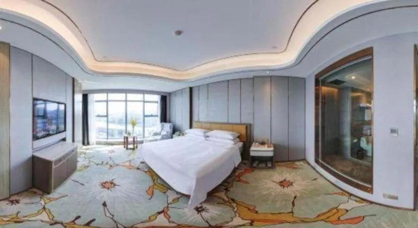 Bed in Venus Royal Hotel Guangxi Wuzhou Sanqicheng Meiguihu Park