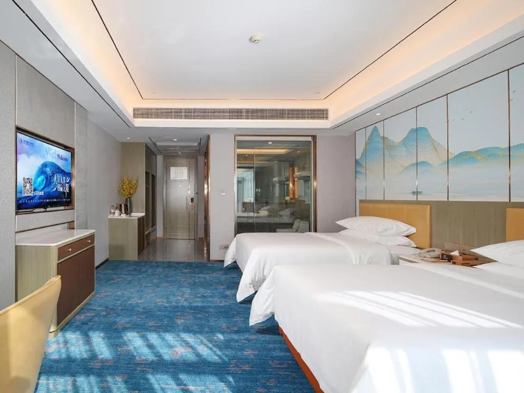 Bed in Venus Royal Hotel Guangxi Wuzhou Sanqicheng Meiguihu Park