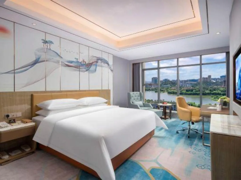 Bed in Venus Royal Hotel Guangxi Wuzhou Sanqicheng Meiguihu Park