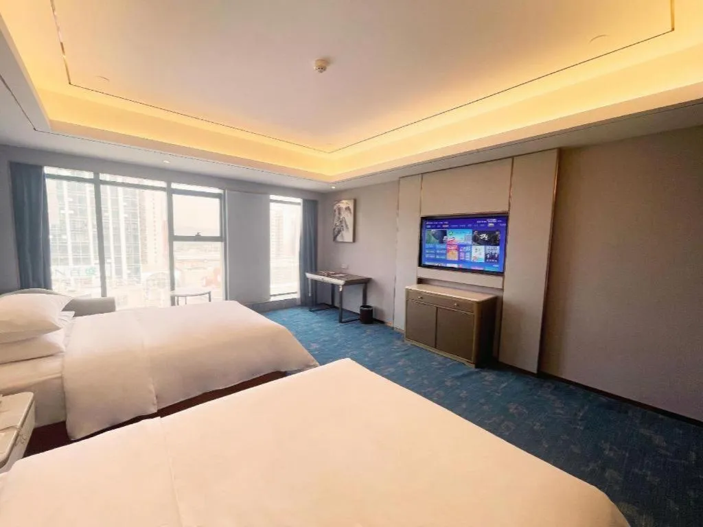 Bed in Venus Royal Hotel Guangxi Wuzhou Sanqicheng Meiguihu Park