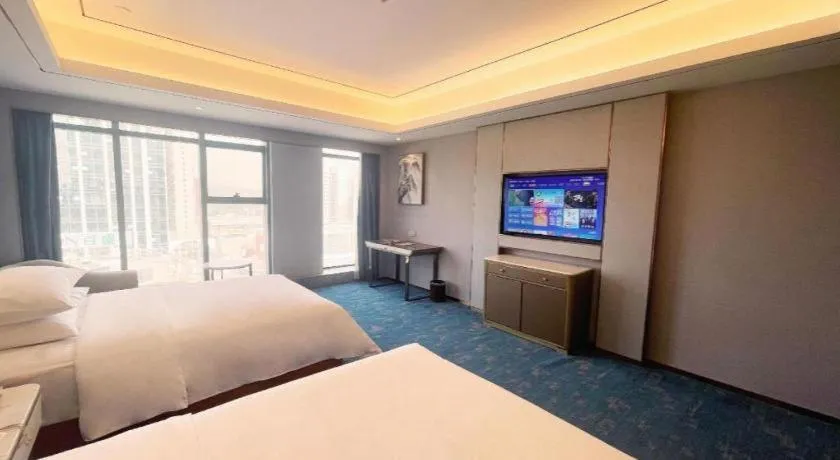 Bed in Venus Royal Hotel Guangxi Wuzhou Sanqicheng Meiguihu Park