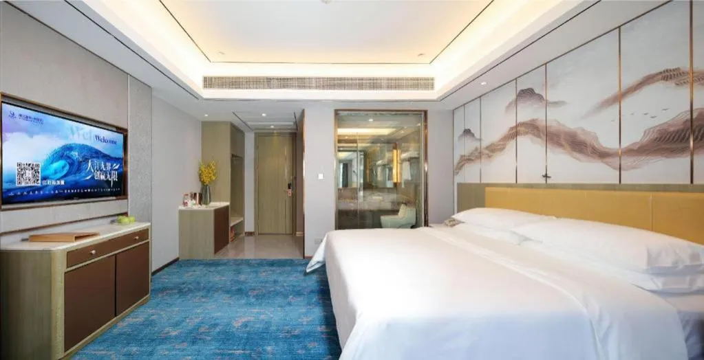 Bed in Venus Royal Hotel Guangxi Wuzhou Sanqicheng Meiguihu Park