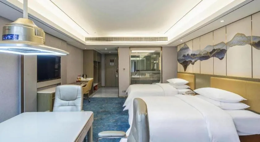 Bed in Venus Royal Hotel Guangxi Wuzhou Sanqicheng Meiguihu Park