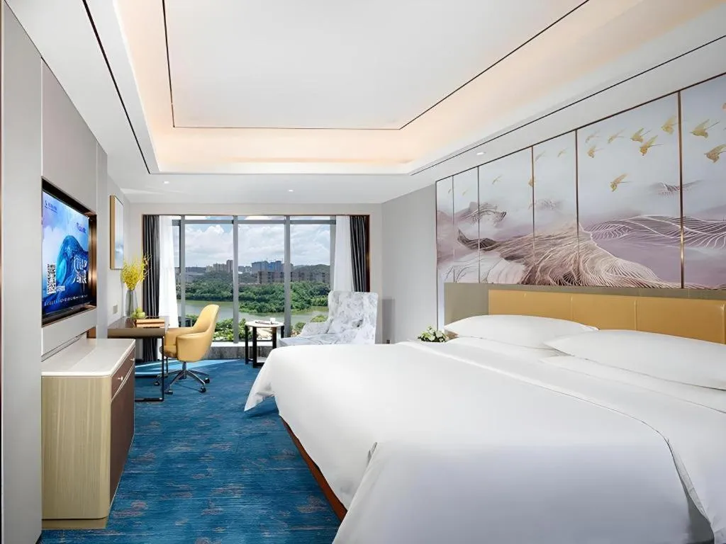 Bed in Venus Royal Hotel Guangxi Wuzhou Sanqicheng Meiguihu Park