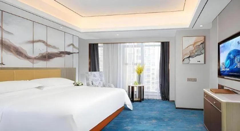 Bed in Venus Royal Hotel Guangxi Wuzhou Sanqicheng Meiguihu Park