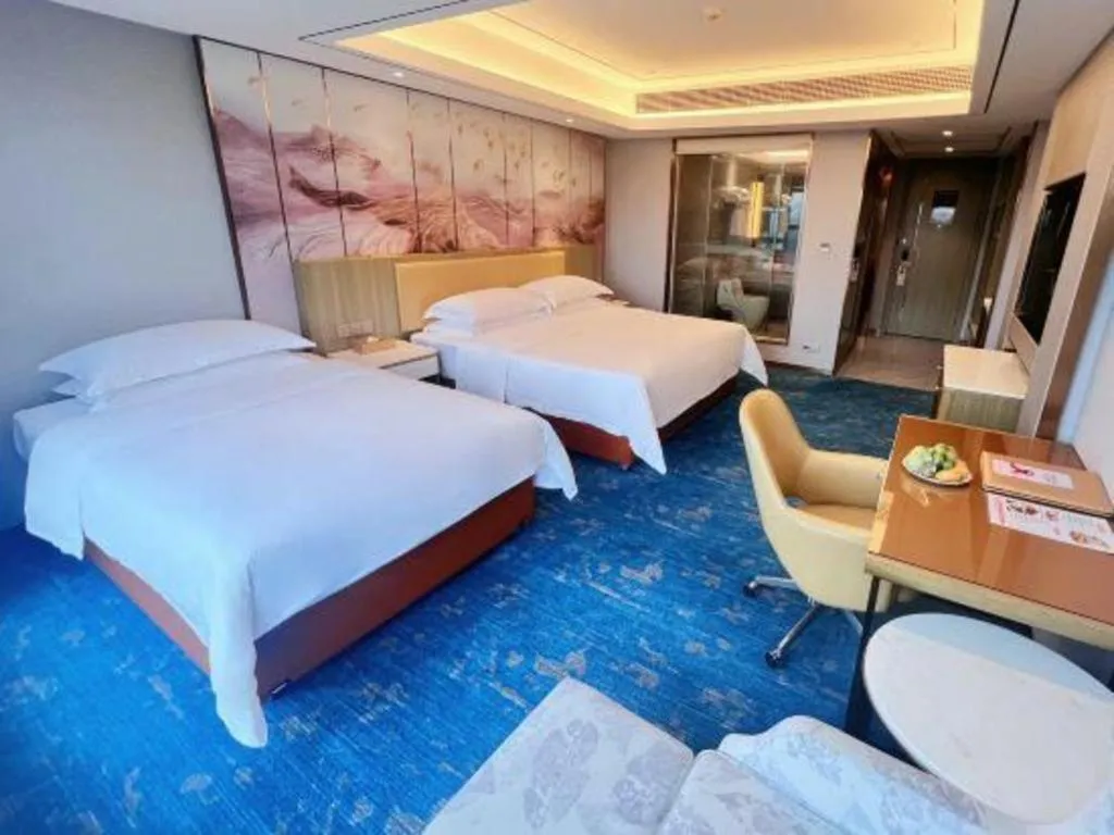 Bed in Venus Royal Hotel Guangxi Wuzhou Sanqicheng Meiguihu Park