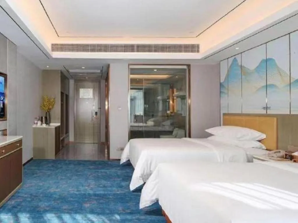 Bed in Venus Royal Hotel Guangxi Wuzhou Sanqicheng Meiguihu Park