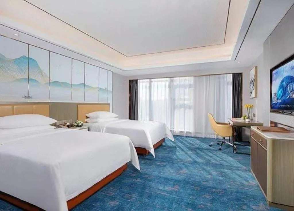 Bed in Venus Royal Hotel Guangxi Wuzhou Sanqicheng Meiguihu Park