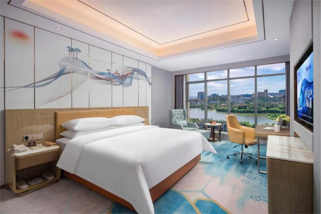 Bed in Venus Royal Hotel Guangxi Wuzhou Sanqicheng Meiguihu Park