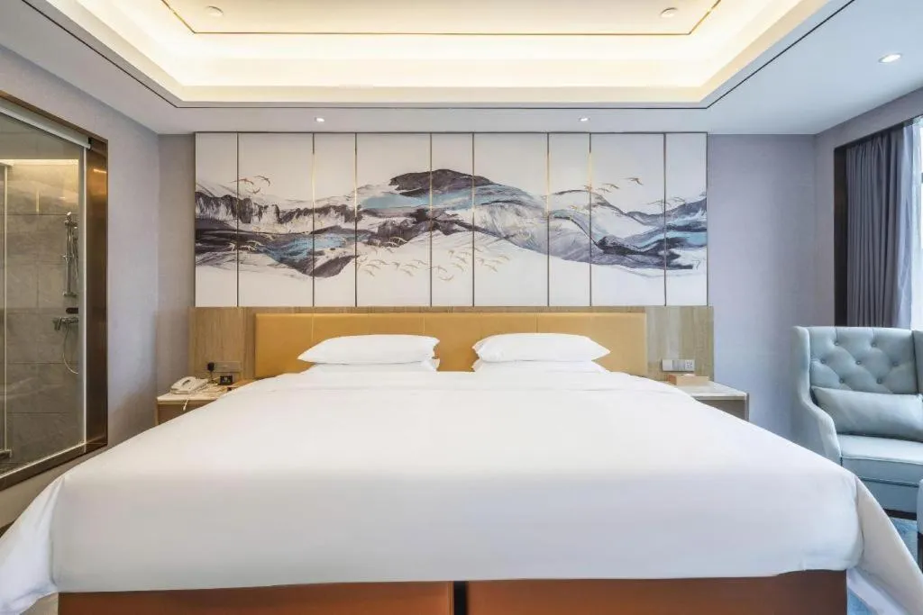 Bed in Venus Royal Hotel Guangxi Wuzhou Sanqicheng Meiguihu Park