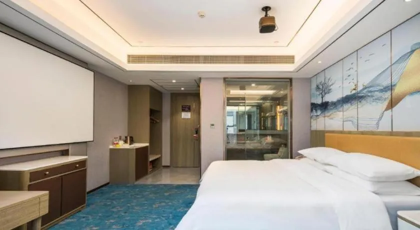 Bed in Venus Royal Hotel Guangxi Wuzhou Sanqicheng Meiguihu Park