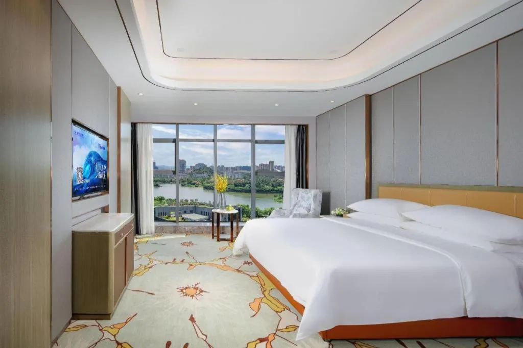 Bed in Venus Royal Hotel Guangxi Wuzhou Sanqicheng Meiguihu Park