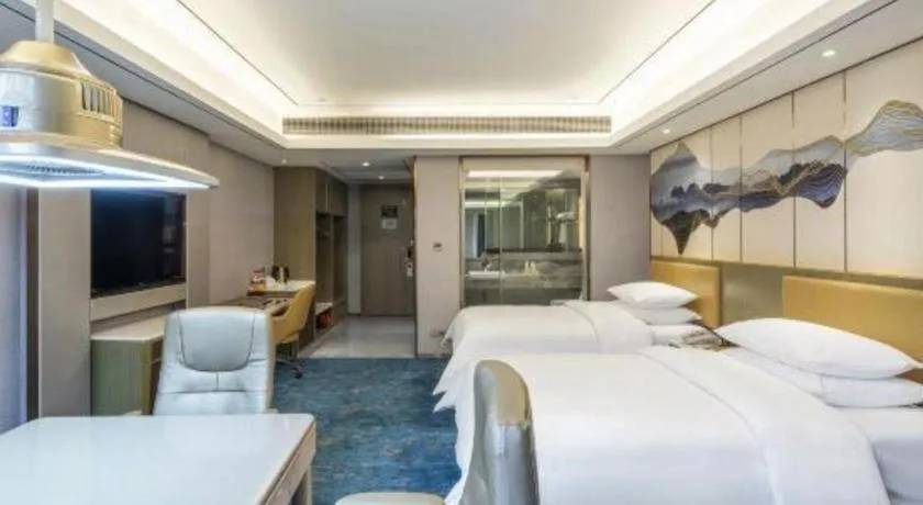 Bed in Venus Royal Hotel Guangxi Wuzhou Sanqicheng Meiguihu Park