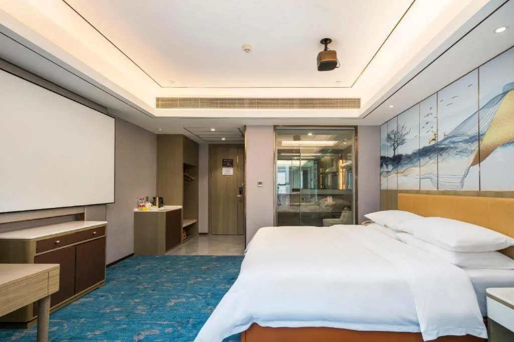 Bed in Venus Royal Hotel Guangxi Wuzhou Sanqicheng Meiguihu Park