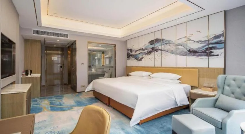 Bed in Venus Royal Hotel Guangxi Wuzhou Sanqicheng Meiguihu Park