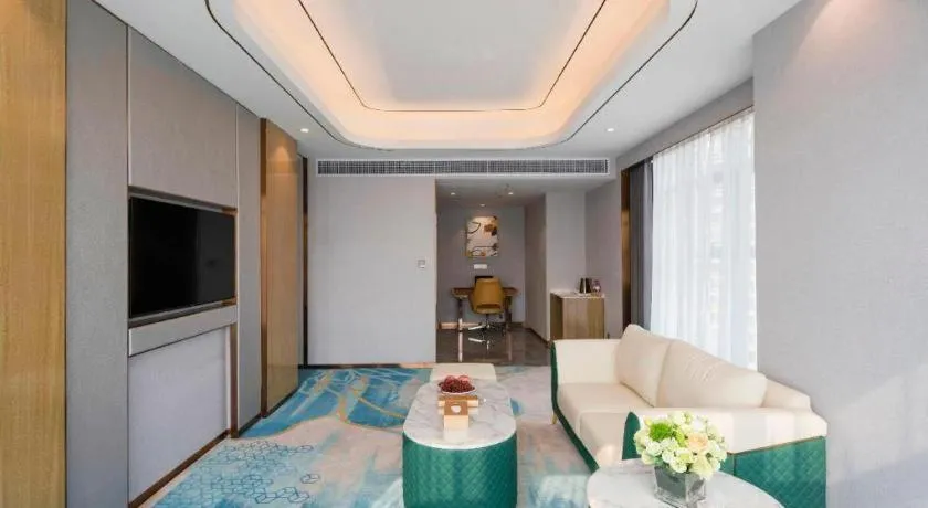 Bed in Venus Royal Hotel Guangxi Wuzhou Sanqicheng Meiguihu Park