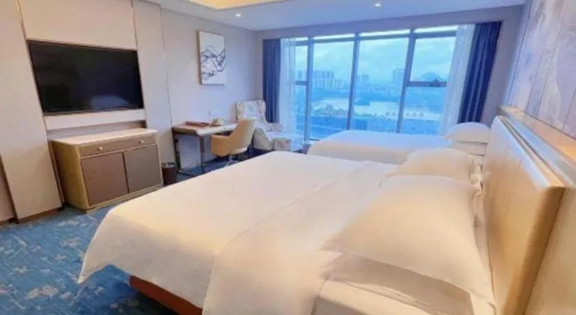 Bed in Venus Royal Hotel Guangxi Wuzhou Sanqicheng Meiguihu Park