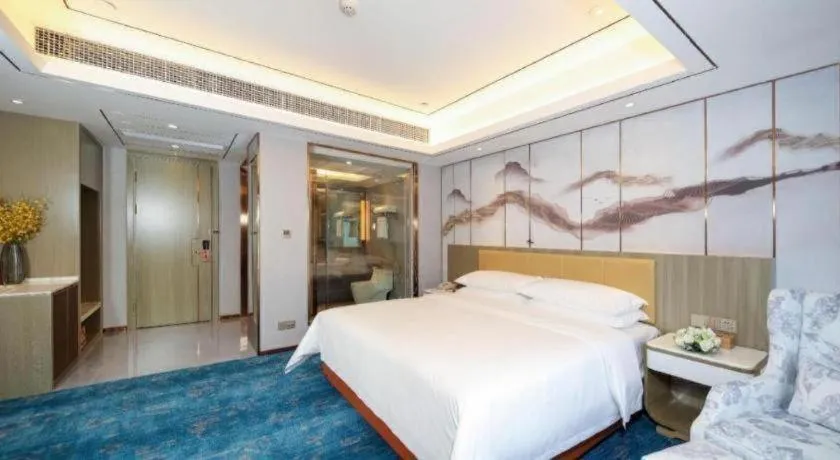 Bed in Venus Royal Hotel Guangxi Wuzhou Sanqicheng Meiguihu Park