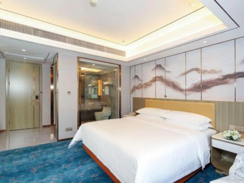 Bed in Venus Royal Hotel Guangxi Wuzhou Sanqicheng Meiguihu Park