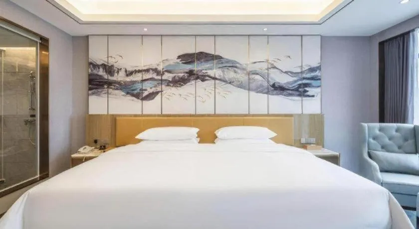 Bed in Venus Royal Hotel Guangxi Wuzhou Sanqicheng Meiguihu Park