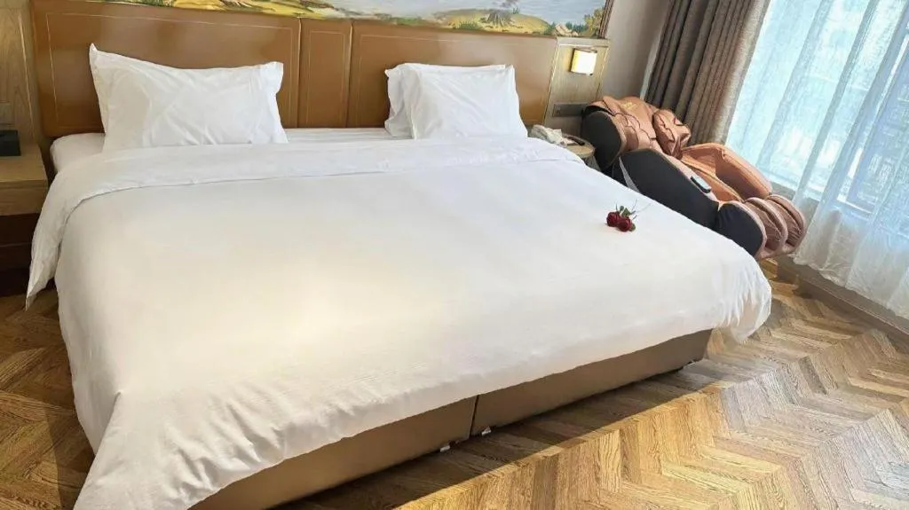 Bed in Vienna Hotel Jiangxi Ganzhou Ningdu Bus Station