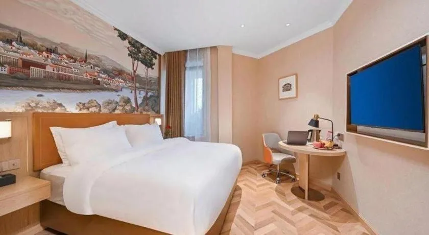 Bed in Vienna Hotel Jiangxi Ganzhou Ningdu Bus Station