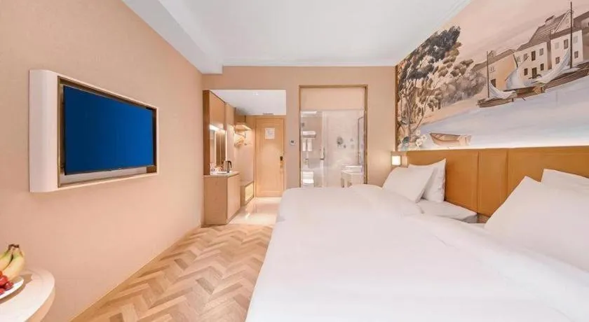 Bed in Vienna Hotel Jiangxi Ganzhou Ningdu Bus Station