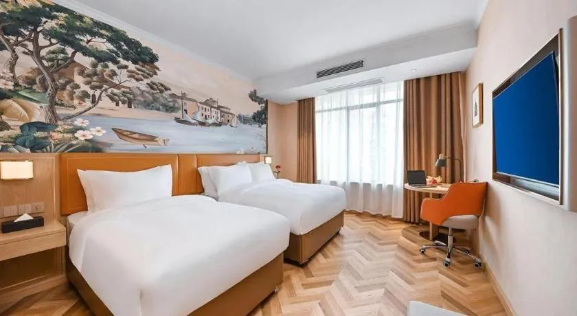 Bed in Vienna Hotel Jiangxi Ganzhou Ningdu Bus Station