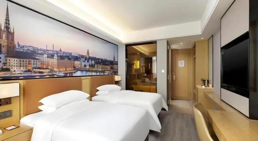 Bed in Vienna Hotel Jiangxi Shangrao High-Speed Railway Station