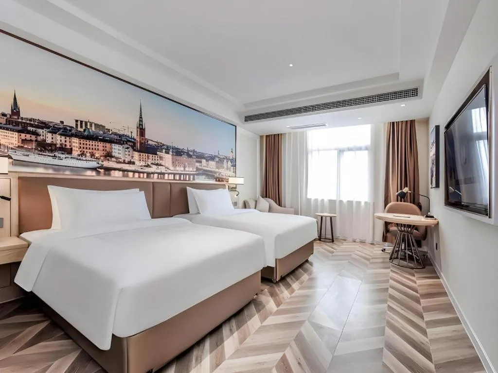 Bed in Vienna Hotel Sichuan Hejiang Yangtze River Bridge