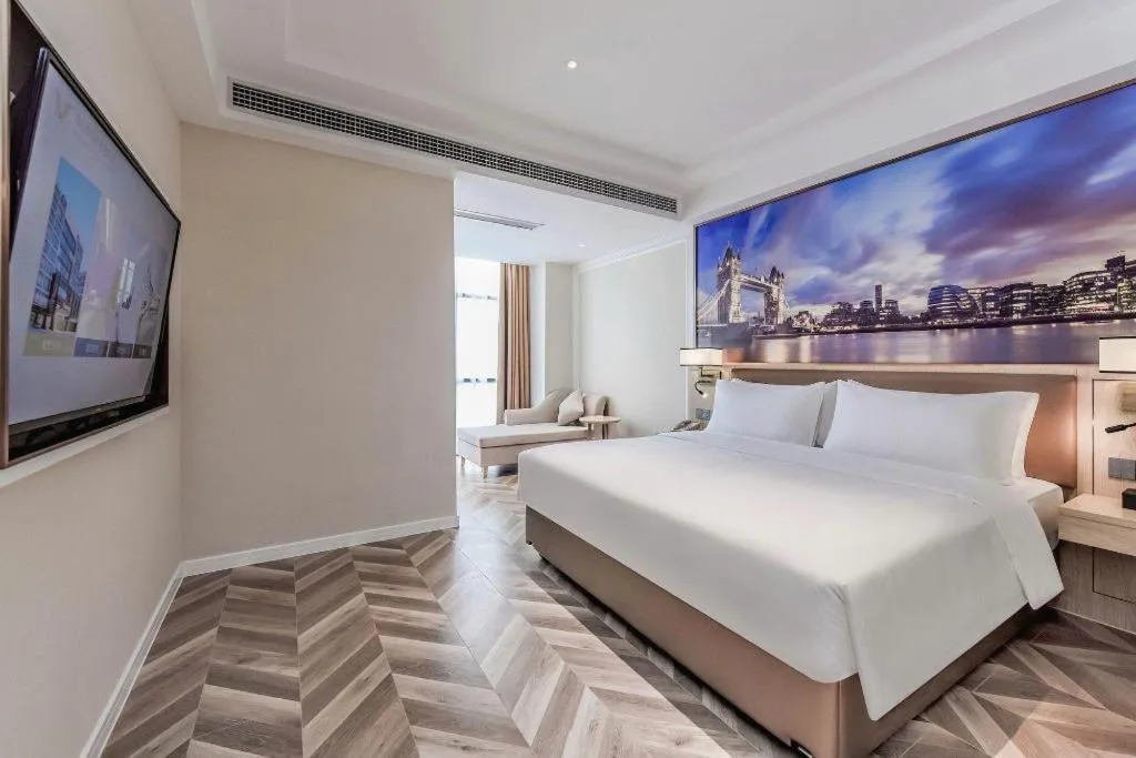 Bed in Vienna Hotel Sichuan Hejiang Yangtze River Bridge