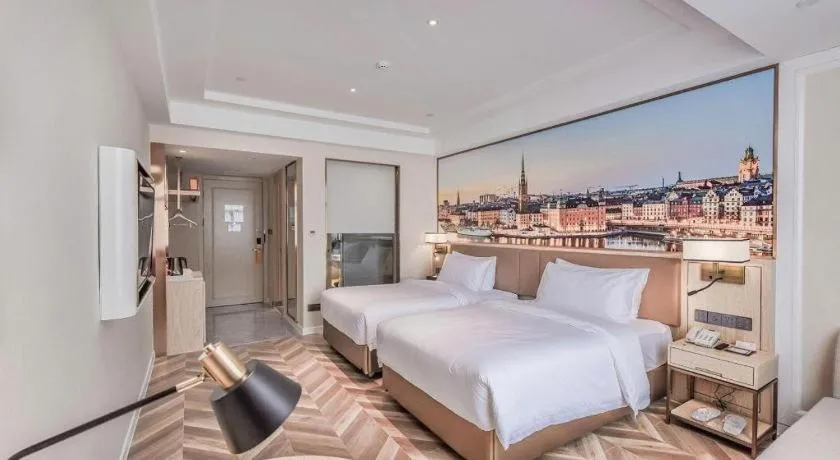 Bed in Vienna Hotel Sichuan Hejiang Yangtze River Bridge