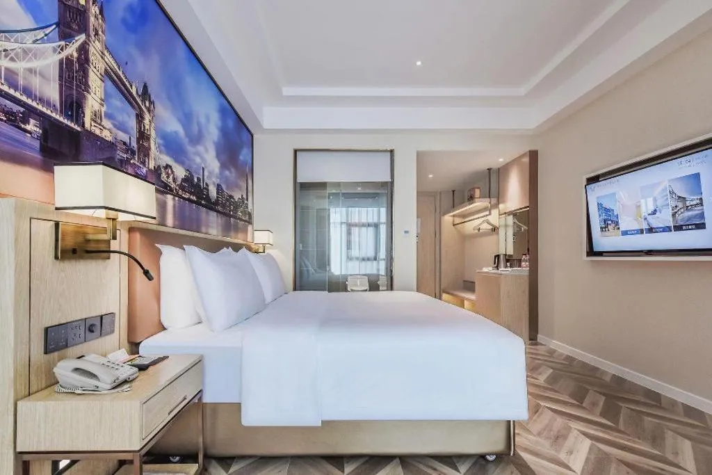 Bed in Vienna Hotel Sichuan Hejiang Yangtze River Bridge