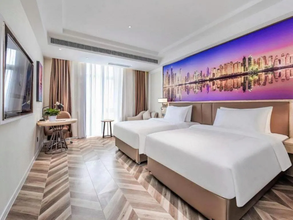 Bed in Vienna Hotel Sichuan Hejiang Yangtze River Bridge