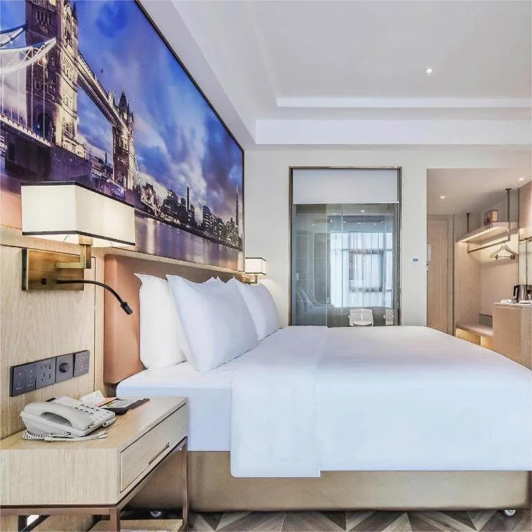 Bed in Vienna Hotel Sichuan Hejiang Yangtze River Bridge