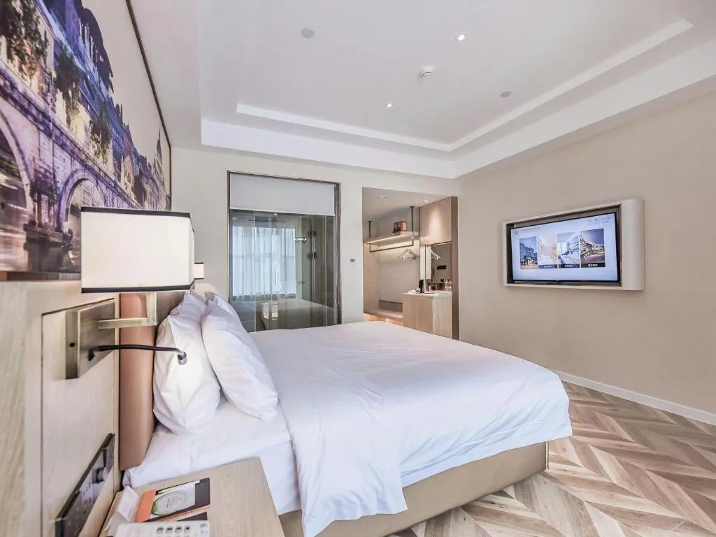 Bed in Vienna Hotel Sichuan Hejiang Yangtze River Bridge