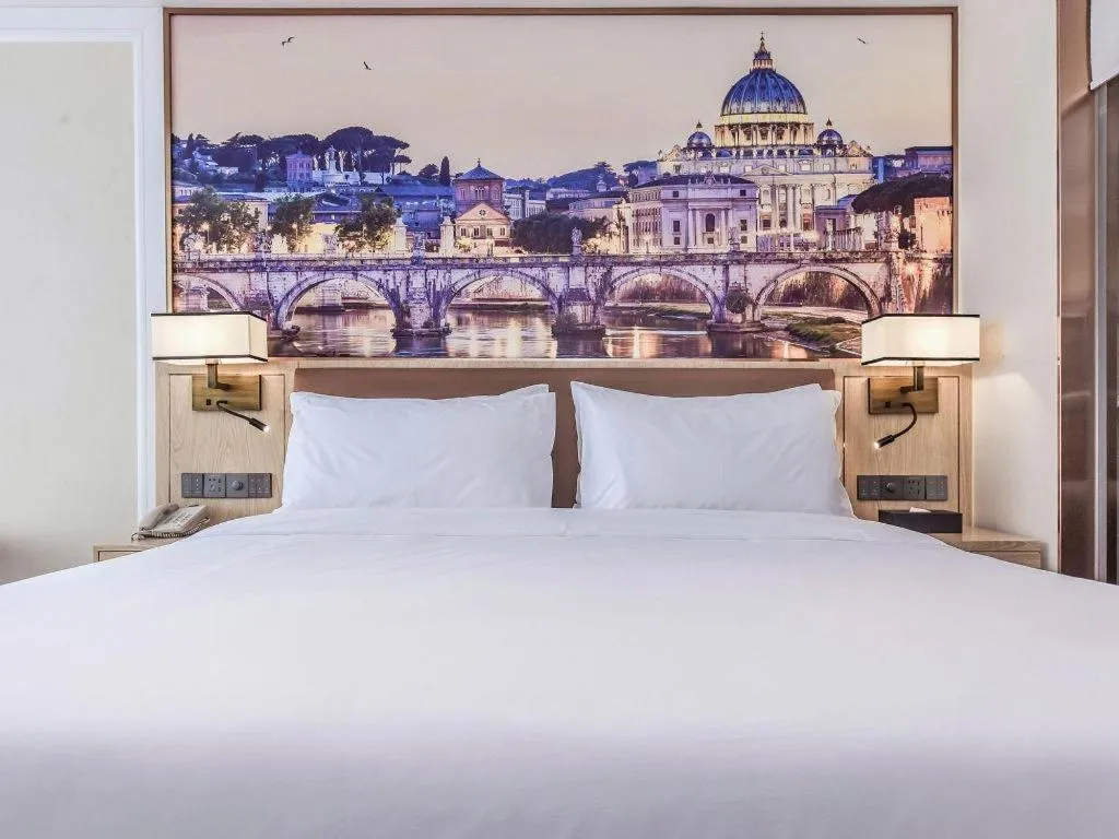 Bed in Vienna Hotel Sichuan Hejiang Yangtze River Bridge