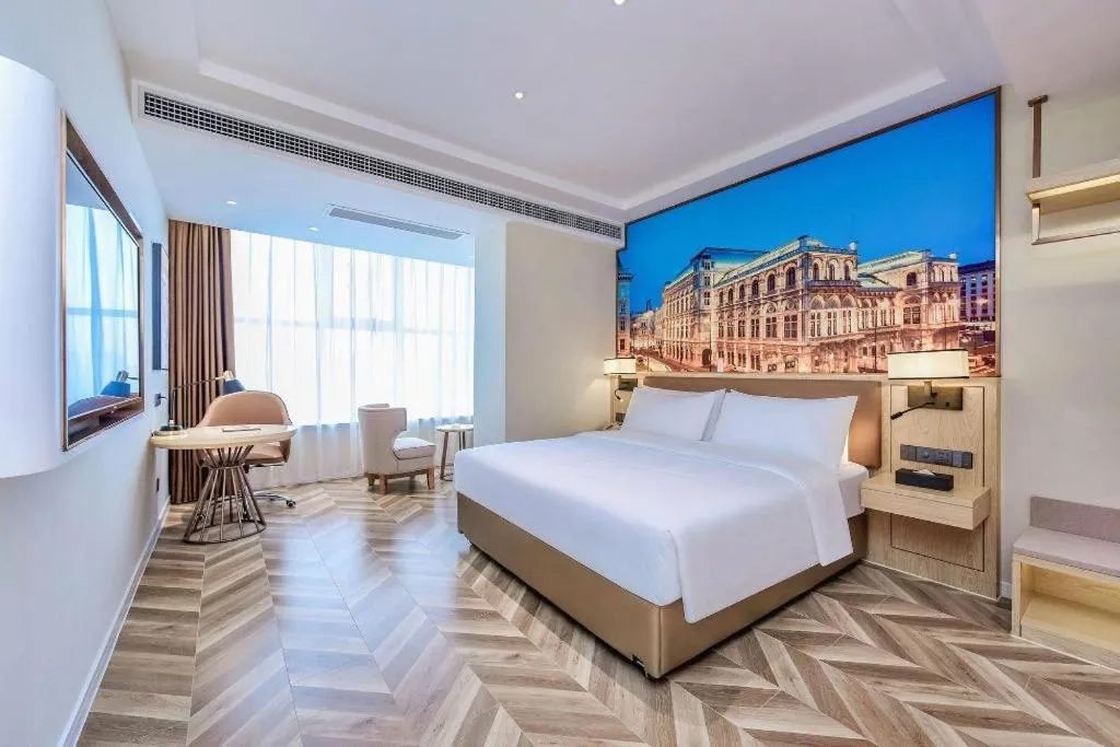 Bed in Vienna Hotel Sichuan Hejiang Yangtze River Bridge