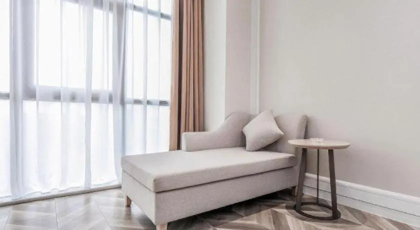 Bed in Vienna Hotel Sichuan Hejiang Yangtze River Bridge