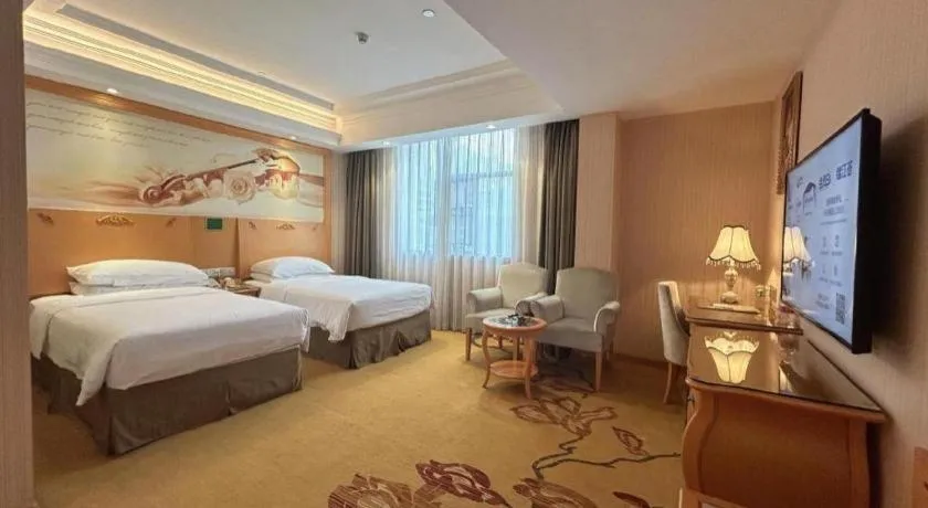 Bed in Vienna Hotel Guangxi Beiliu Passenger Station