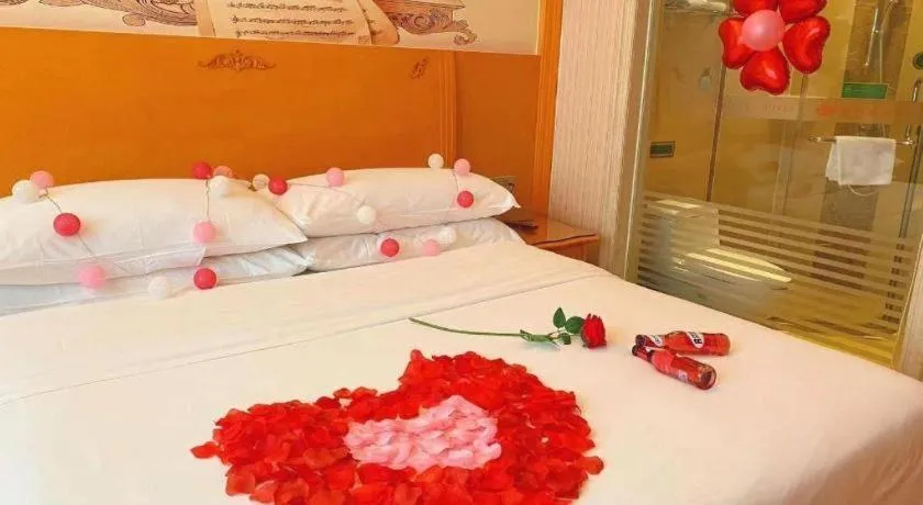 Bed in Vienna Hotel Guangxi Beiliu Passenger Station