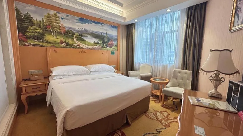 Bed in Vienna Hotel Guangxi Beiliu Passenger Station