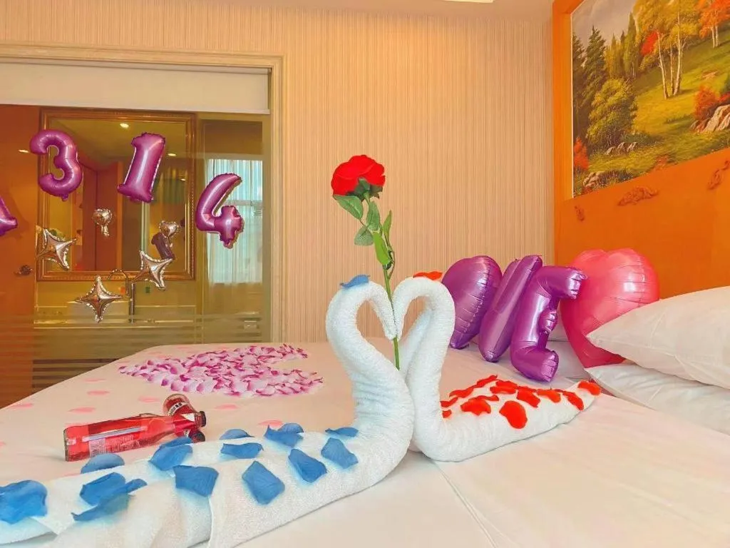 Bed in Vienna Hotel Guangxi Beiliu Passenger Station