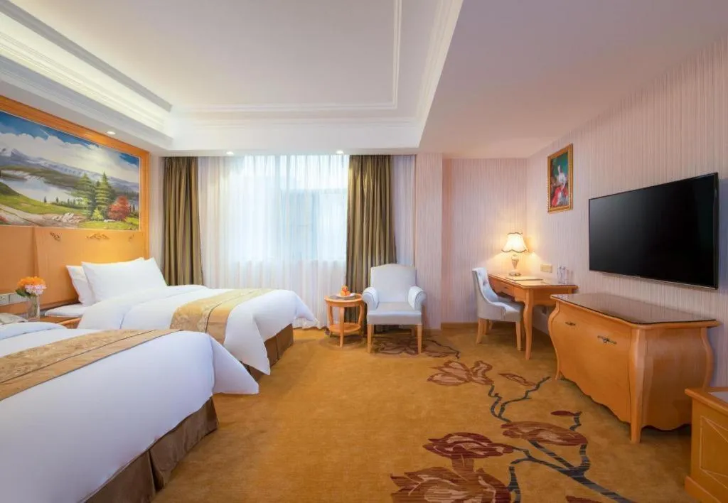 Bed in Vienna Hotel Guangxi Beiliu Passenger Station