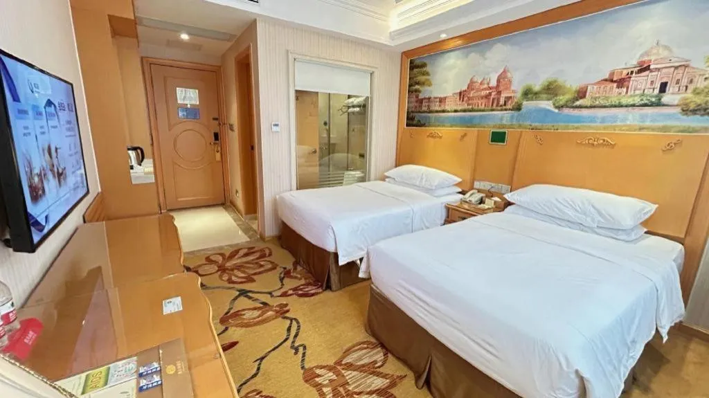 Bed in Vienna Hotel Guangxi Beiliu Passenger Station