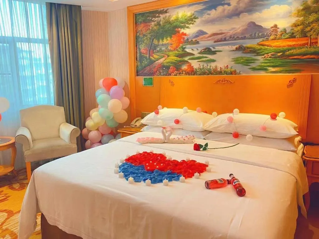 Bed in Vienna Hotel Guangxi Beiliu Passenger Station