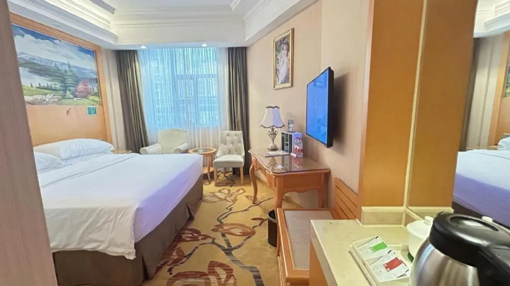 Bed in Vienna Hotel Guangxi Beiliu Passenger Station