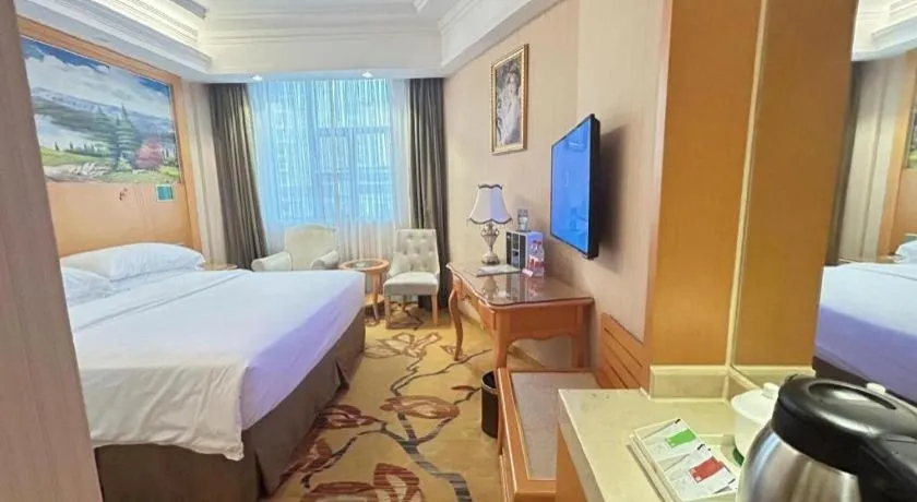 Bed in Vienna Hotel Guangxi Beiliu Passenger Station