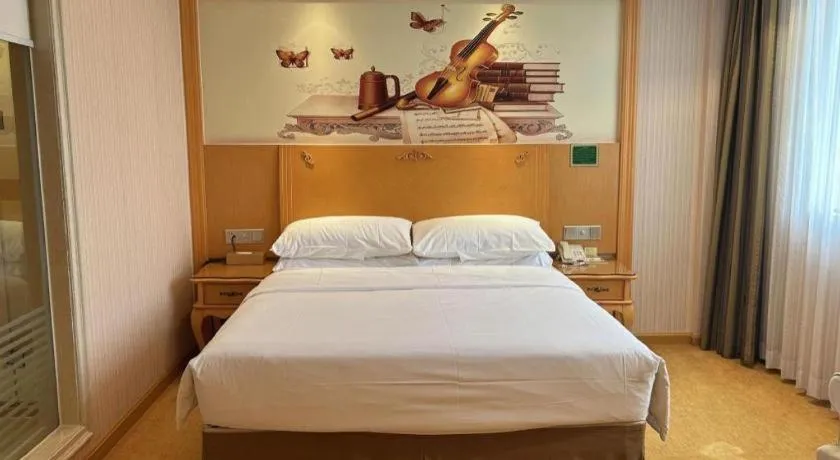 Bed in Vienna Hotel Guangxi Beiliu Passenger Station