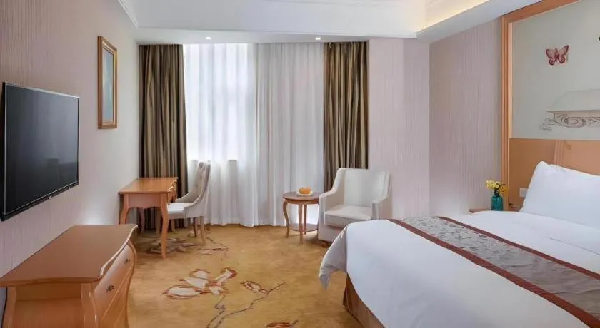 Bed in Vienna Hotel Guangxi Beiliu Passenger Station